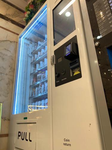 a pull refrigerator with its door open in a room at فندق غزالة برفكت توصيل مجاني للحرم - Ghazala Perfect Hotel Free shuttle service to the Haram in Makkah