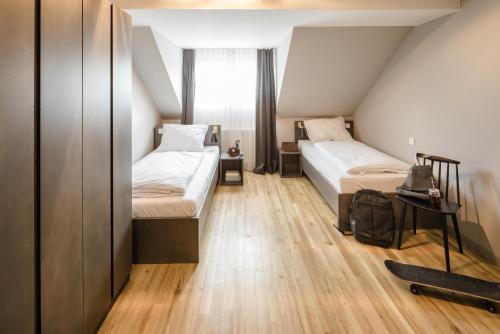 Ένα ή περισσότερα κρεβάτια σε δωμάτιο στο Bold Hotel Frankfurt Messe
