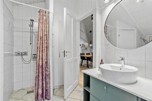 a bathroom with a sink and a mirror at 0155-Romo-Davidstraede-10-c in Kongsmark