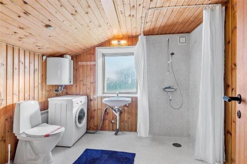 a bathroom with a toilet a sink and a shower at 0053-Romo-Lakolk-19 in Lakolk