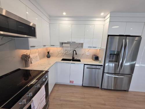 Kuchyň nebo kuchyňský kout v ubytování PeachView Deluxe Suites 301