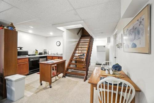 a kitchen with a spiral staircase in a room at 10 Mi to Dtwn Cozy Couples Getaway in Cincinnati in Cincinnati