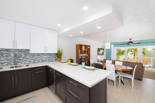a kitchen with a counter top and a dining room at Caribbean Paradise #29 Condo in Lambert House