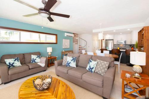 a living room with a couch and a table at Caribbean Paradise #29 Condo in Lambert House