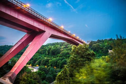 a red bridge with lights on top of it at Cosy European Instituts in Luxembourg