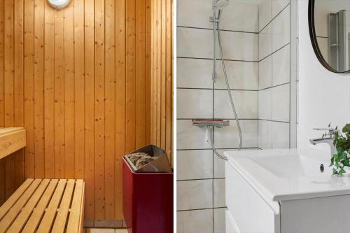 a bathroom with a sink and a shower and a mirror at 2008-Romo-Froidal-10 in Toftum