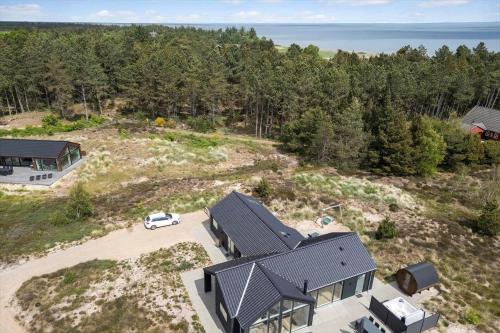 an aerial view of a house with a car parked in front at 2551-Romo-Chresten-Krommes-vej-5 in Tagholm