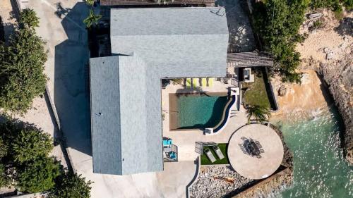 an overhead view of a house with a swimming pool at Seven Mile View Condo #4 in West Bay