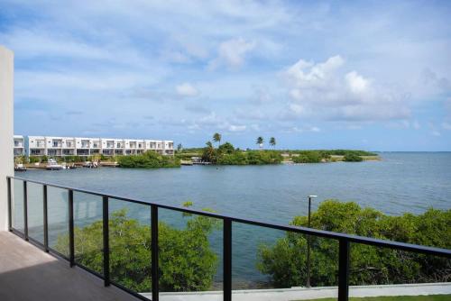 a view of a river from a balcony at Allure #22 3BR Waterfront in Red Bay Estate