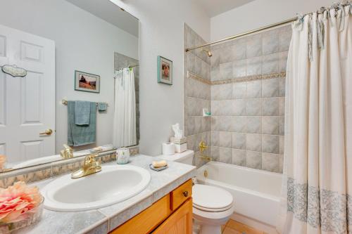 a bathroom with a sink and a tub and a toilet at Pet-Friendly Longmont Home with McIntosh Lake Access in Longmont