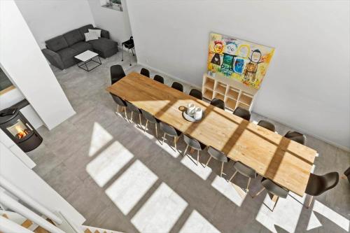 a dining room with a wooden table and chairs at 2007-Romo-Juvrevej-43 in Toftum
