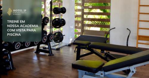 a gym with dumbbells and treadmills at Hotel JP Ribeirão Preto Resort & Convenções by Nacional Inn in Ribeirão Preto