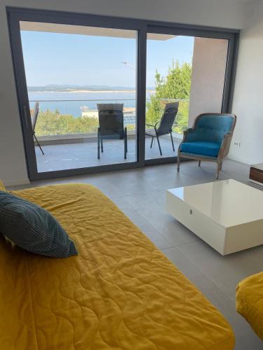a bedroom with a bed and a view of the ocean at Villa Una in Crikvenica