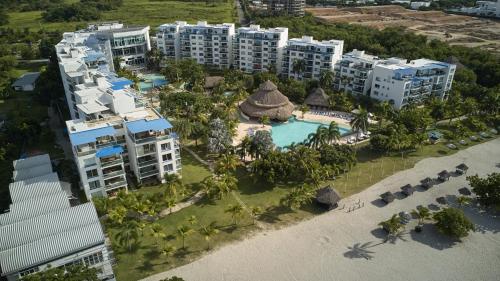 an aerial view of a resort with a swimming pool at Beach Apartment Nikki Steps From The Sea in El Chirú