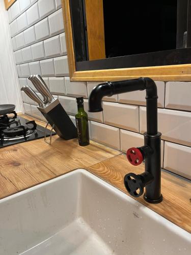 a kitchen sink with a faucet on a counter at Redondo Beach frente al océano in Maldonado