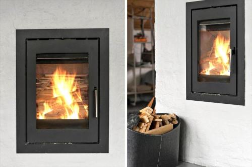 a fireplace is shown with flames in it at 530-Lemvig-Lokkevej-59-D in Lemvig