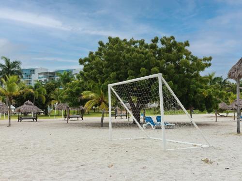a soccer goal on a beach with trees in the background at Beach Apartment At Nikki Residences 2 Bedroom in El Chirú