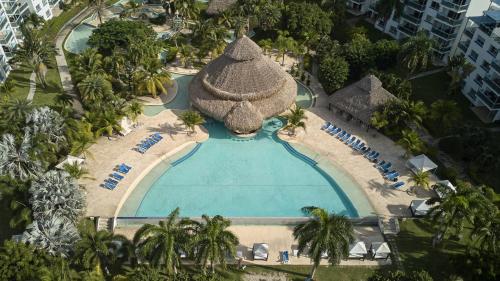 an overhead view of a swimming pool at a resort at Beach Apartment At Nikki Residences 2 Bedroom in El Chirú