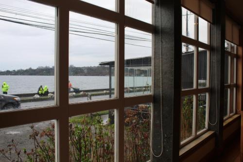 a window view of the water from a building at Hotel Casona Freire in Puerto Varas