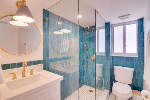 a bathroom with a toilet and a shower and a sink at Walk to Beach Tavernier Apartment with Patio! in Tavernier