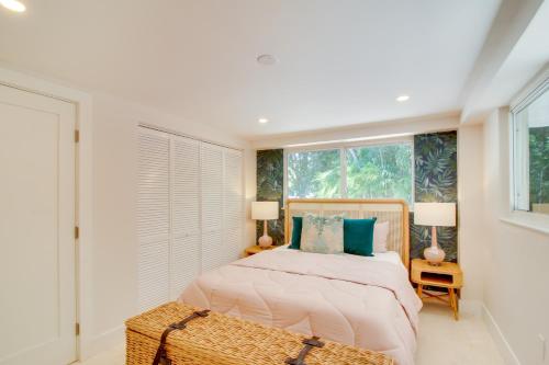 a bedroom with a bed and two windows at Walk to Beach Tavernier Apartment with Patio! in Tavernier