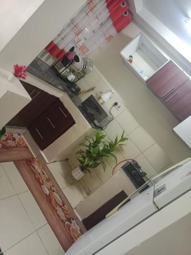 an overhead view of a kitchen with a plant at Stylish 1BR Escape in Thika Sec 2 in Thika