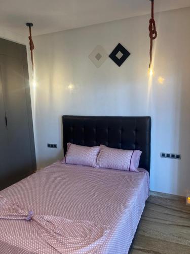 Ένα ή περισσότερα κρεβάτια σε δωμάτιο στο Relaxing Apartment Oceanic Sidi Rahal