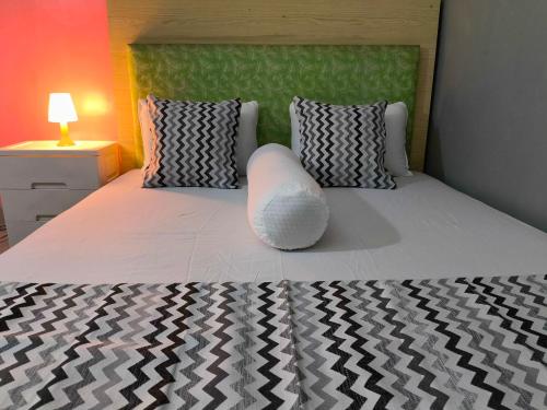 Katil atau katil-katil dalam bilik di Pekalongan StayInn