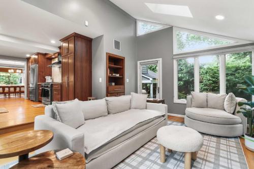 a living room with a couch and a table at Sojourn Beautiful Family Home with Beach Access & Backyard in Falls Church