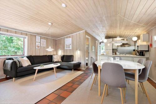 a living room with a couch and a table at BV384-Blavand-Hedevej-47 in Blåvand