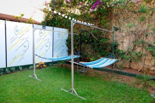 two hammocks in the grass in a yard at Maison à Skhirat Jacuzzi, jardin & proche plage in Skhirat