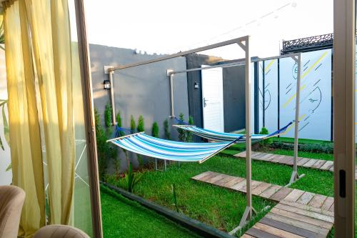 a pair of hammocks sitting on a balcony at Maison à Skhirat Jacuzzi, jardin & proche plage in Skhirat