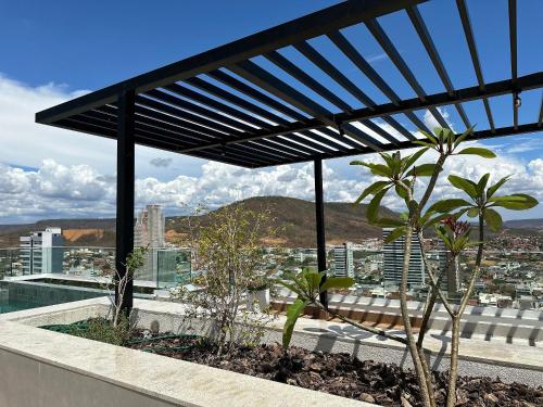a balcony with a view of a city at Apartamentos Exclusivos no Edifício City House in Barreiras