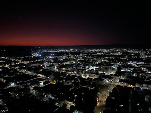 a view of a city at night at Apartamentos Exclusivos no Edifício City House in Barreiras