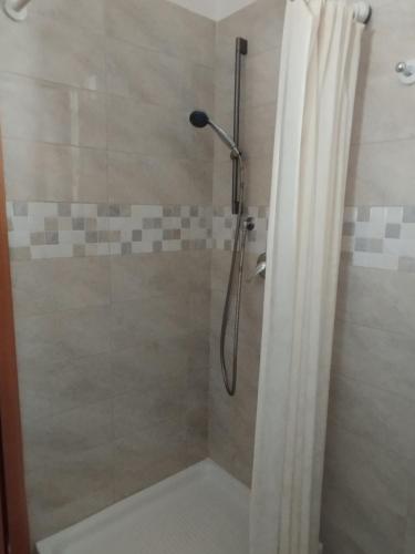 a bathroom with a shower with a shower curtain at Canto delle Rane in Vieste