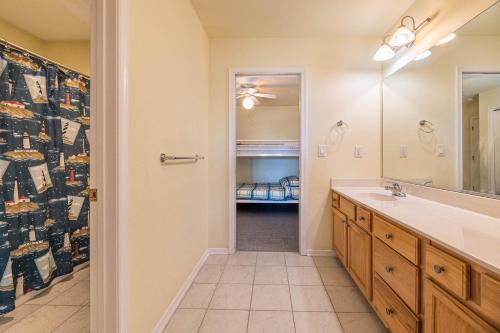a bathroom with a sink and a mirror at Funtiki in Whalebone