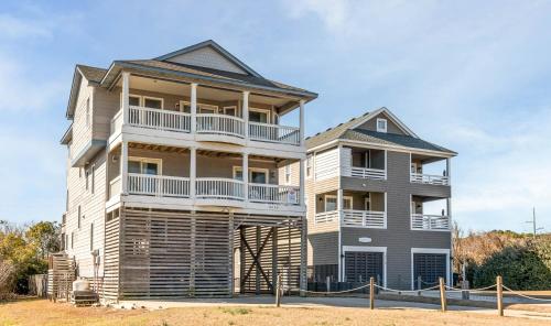 a large house with balconies on the side of it at Funtiki in Whalebone