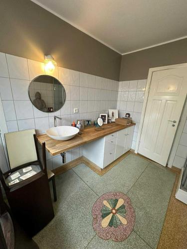 a bathroom with a sink and a mirror at Downtown Villa - Embassy Quarter in Reykjavík