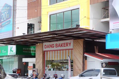 a drug store with motorcycles parked in front of it at Parsons Place in Chiang Mai! in Chiang Mai