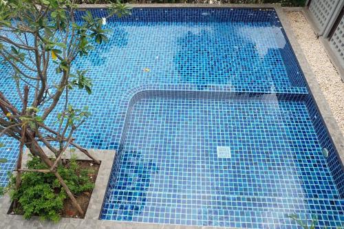 an overhead view of a blue swimming pool at Parsons Place in Chiang Mai! in Chiang Mai