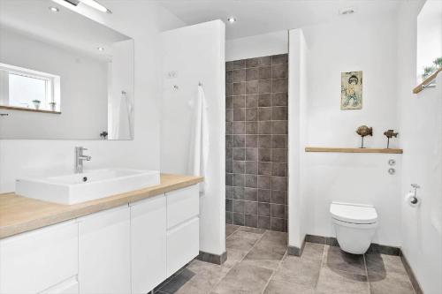 a white bathroom with a sink and a toilet at 873-Melby-Bygtoften-3 in Melby