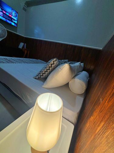 a bed on a boat with pillows on it at Semarang CoStay in Alastuwo