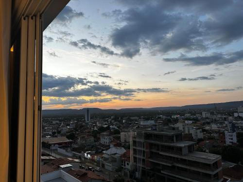 a view from a window of a city at sunset at Apartamentos Exclusivos no Edifício City House in Barreiras