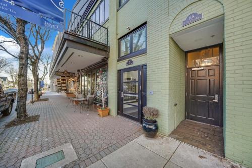 a building with a door on the side of a street at Loft Apt with Balcony in the Heart of Kennett Square in Kennett Square