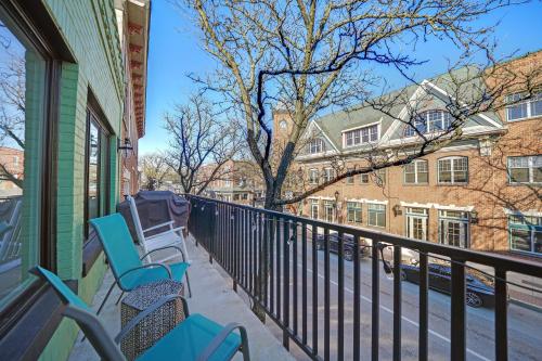 a balcony with blue chairs on a building at Loft Apt with Balcony in the Heart of Kennett Square in Kennett Square