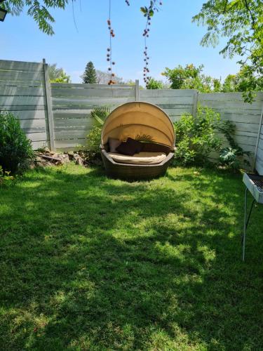a boat sitting in a yard next to a fence at Itamar Cabins in Had Nes