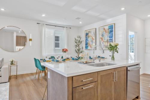a kitchen with a sink and a counter top at Luxury Resort Pool Spa Arcade Movie Gym in Mission Viejo