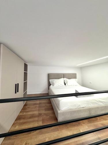 a bedroom with a bed in a room at Nest Apartments in Tirana