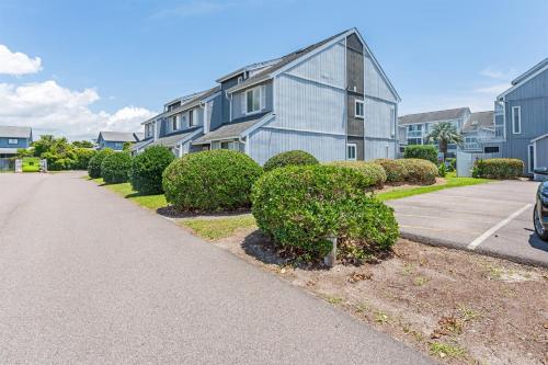 a row of bushes in front of a building at NEW! Large 1BR at The Golf Colony at Baytree, Pool in Stephens Crossroads
