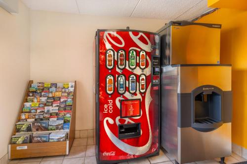 a coca cola vending machine next to a refrigerator at Red Roof Inn Erie – I-90 in Erie